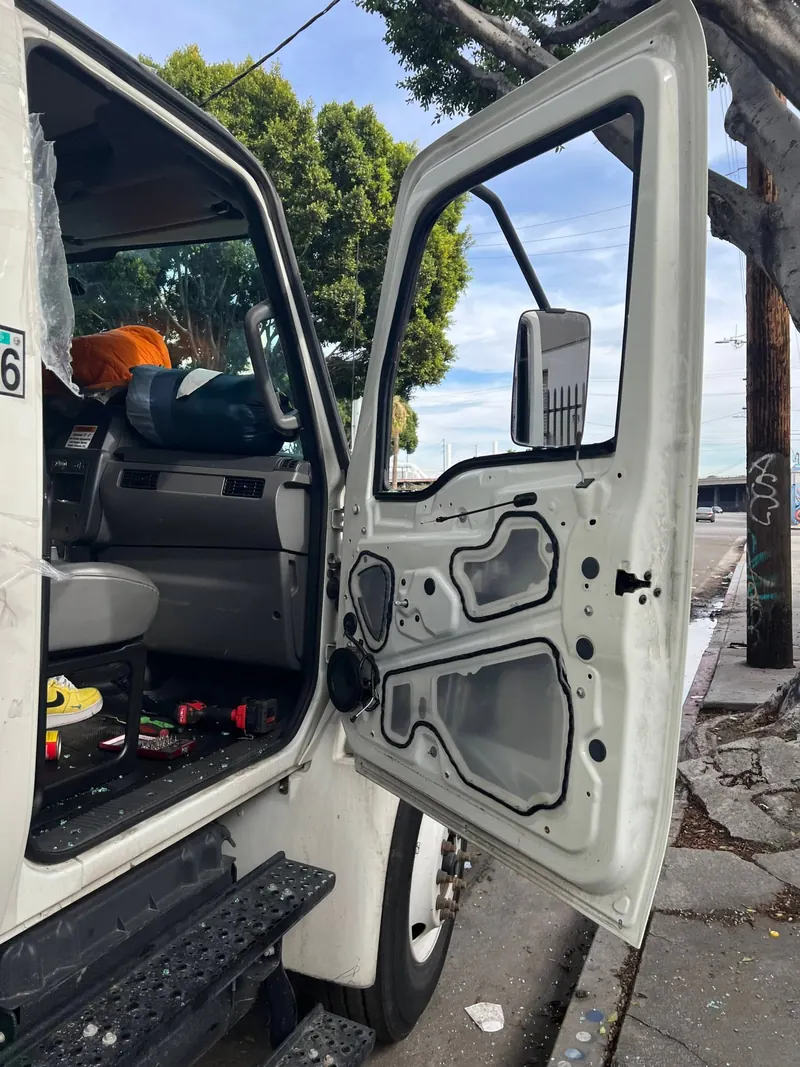 Commercial truck door opened for door glass replacement in Los Angeles